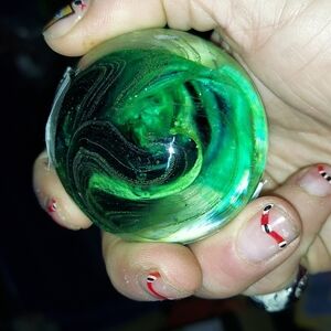 Smaller hand blown glass paper weight by Joe rice